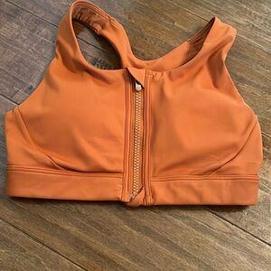 New without tags Athleta zip front sports bra.